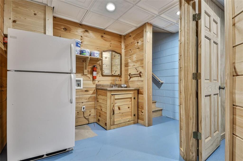 178 Novena Court Ellijay, GA 30540 - Photo 39 of 88 a white refrigerator freezer and a stove sitting inside of a kitchen