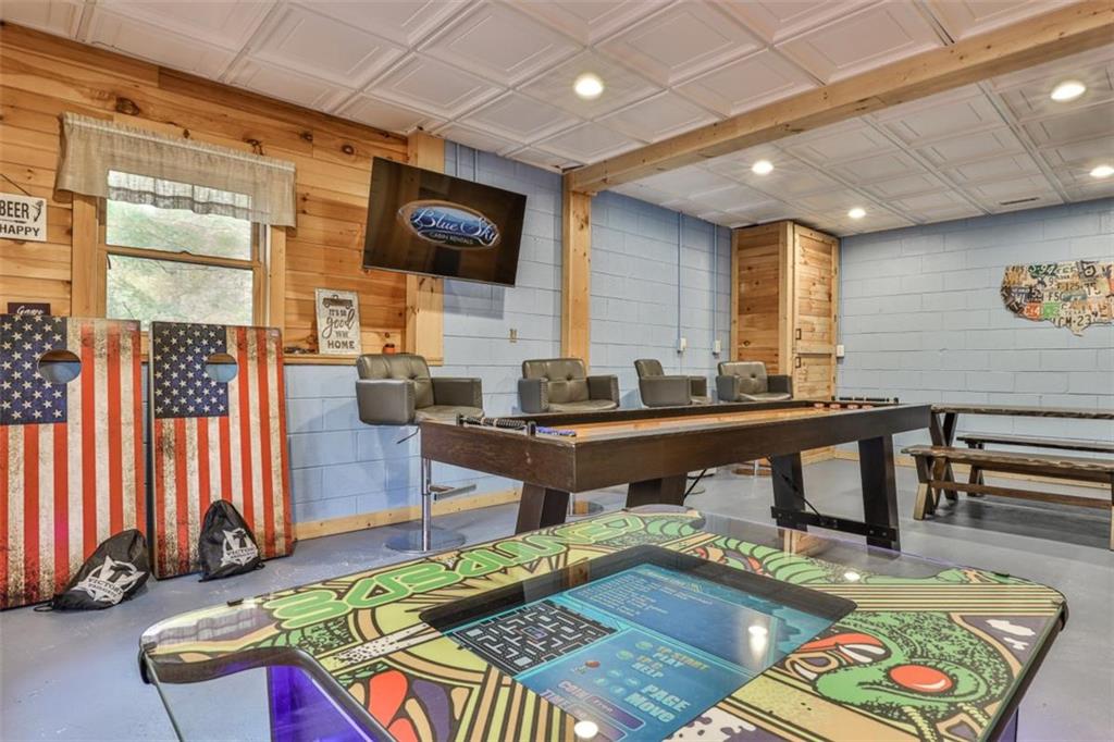178 Novena Court Ellijay, GA 30540 - Photo 42 of 88 a living room with furniture a flat screen tv and kitchen view