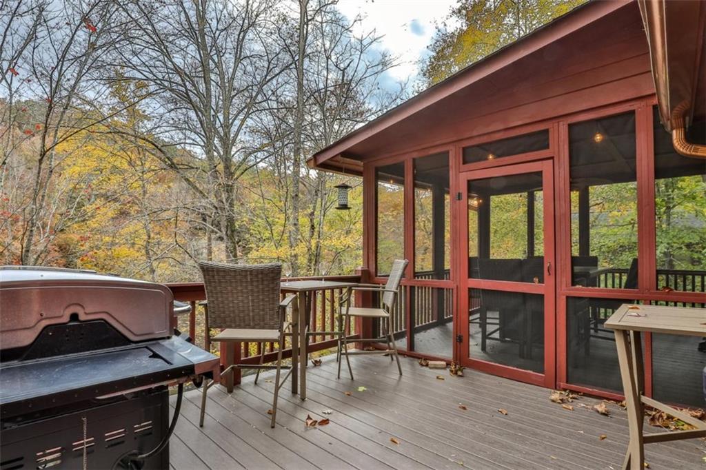 178 Novena Court Ellijay, GA 30540 - Photo 45 of 88 a view of a patio with table and chairs and wooden floor