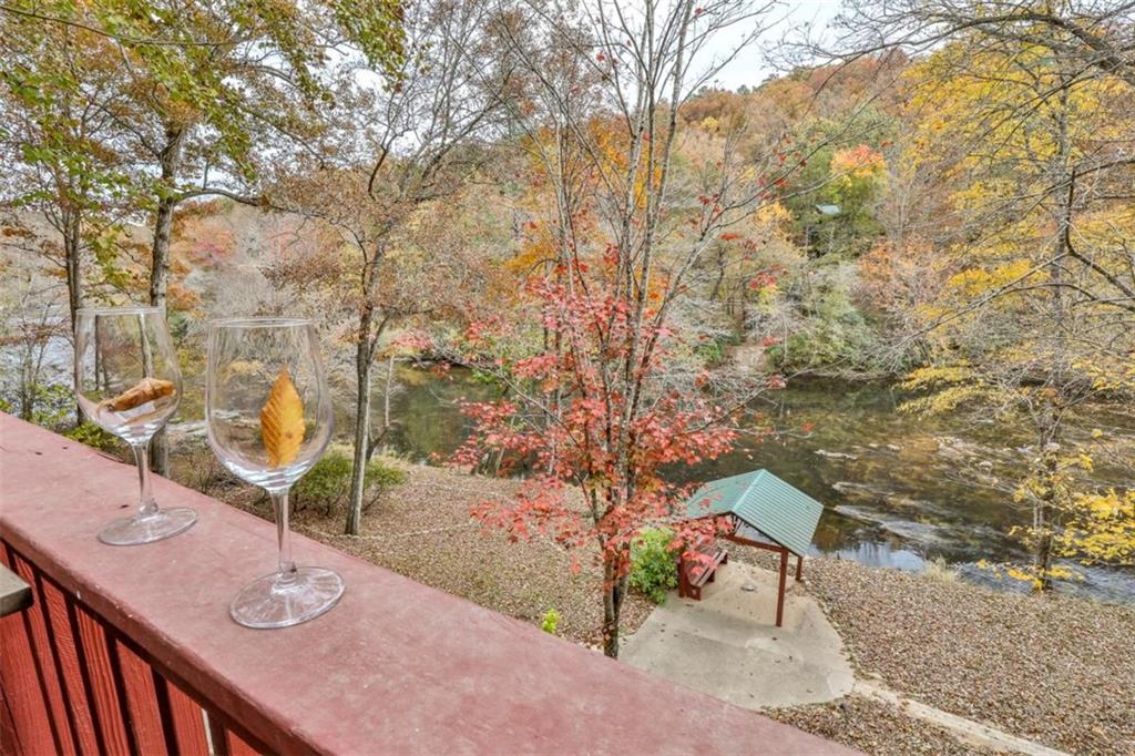 178 Novena Court Ellijay, GA 30540 - Photo 46 of 88 a backyard of a house with table and chairs