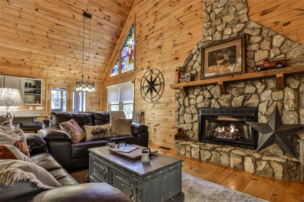 178 Novena Court Ellijay, GA 30540 - Photo 10 of 88 a living room with furniture a fireplace and a flat screen tv