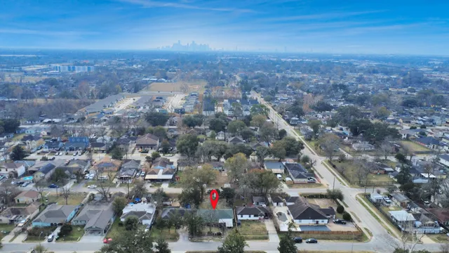 an aerial view of residential houses with outdoor space