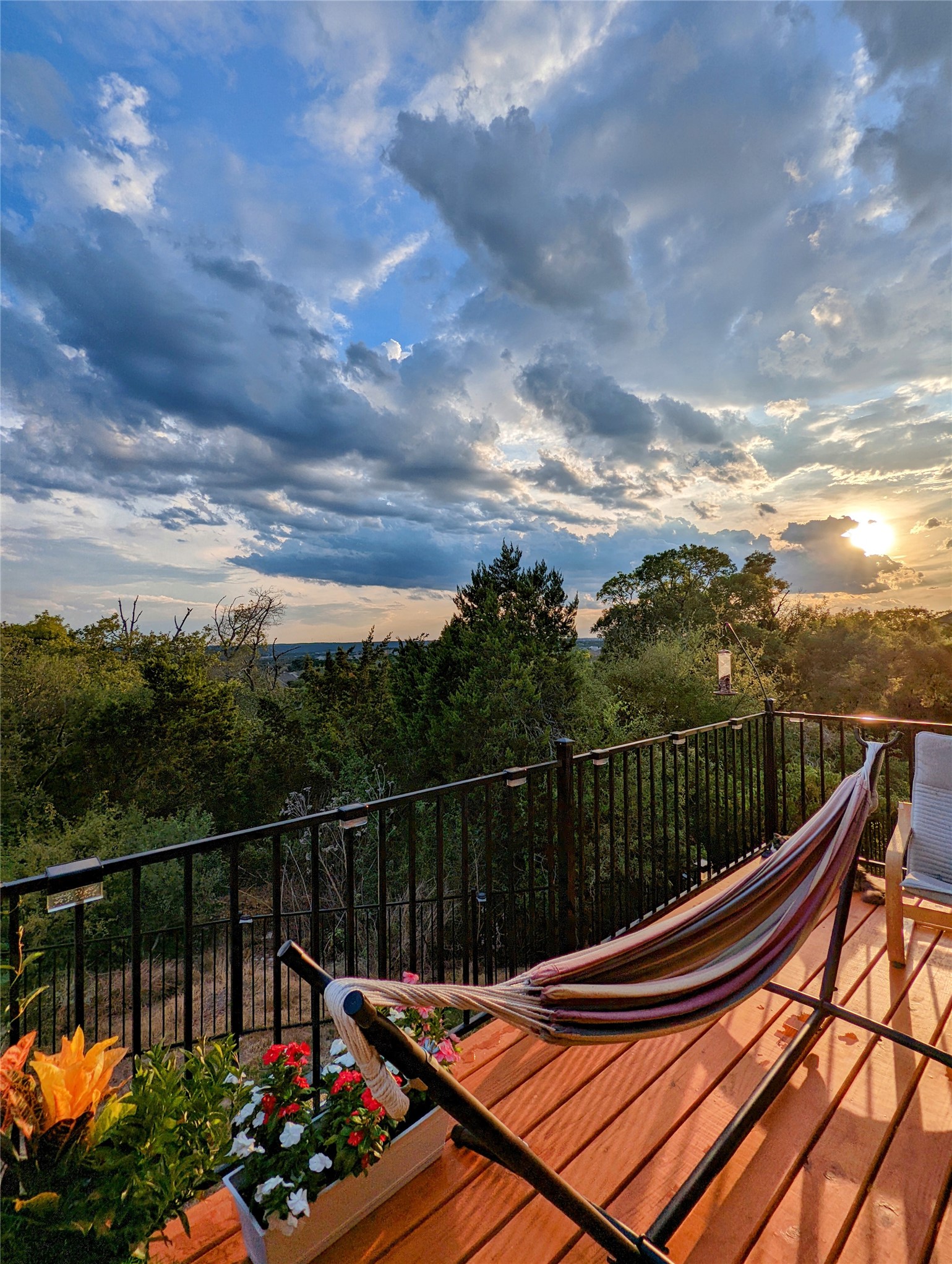 1722 Rowdy Loop, Unit 7 Leander, TX 78641 - Photo 32 of 37 Experience serene sunsets from this inviting deck, complete with a hammock and lush greenery views.