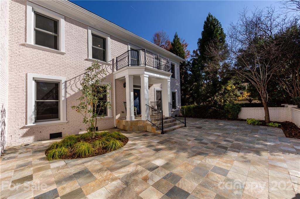 4407 Oglukian Road Charlotte, NC 28226 - Photo 2 of 48 a view of a white house with a large windows and a small yard