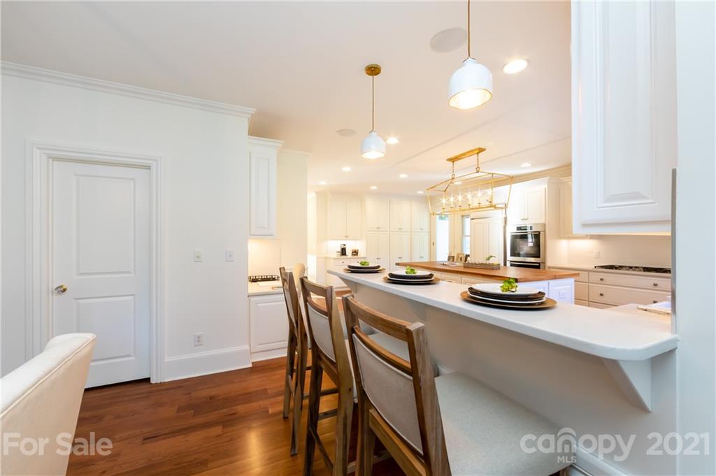 4407 Oglukian Road Charlotte, NC 28226 - Photo 11 of 48 a kitchen with a table and chairs in it