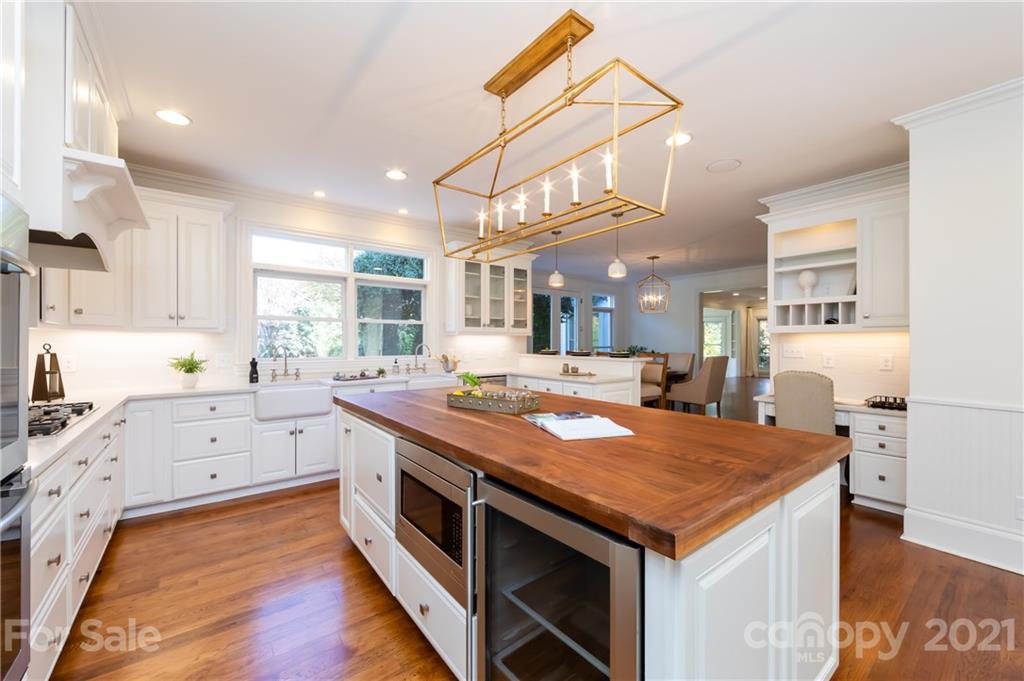 4407 Oglukian Road Charlotte, NC 28226 - Photo 14 of 48 a kitchen with a stove and a view of kitchen