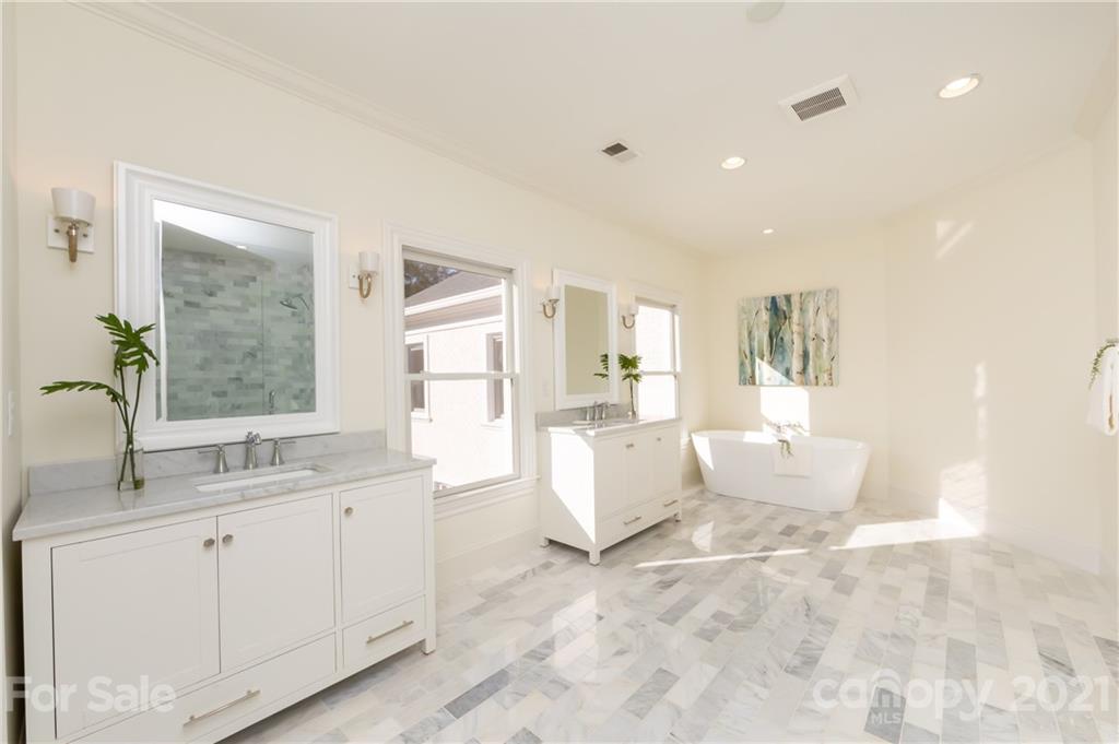 4407 Oglukian Road Charlotte, NC 28226 - Photo 32 of 48 a large white room with mirror and windows