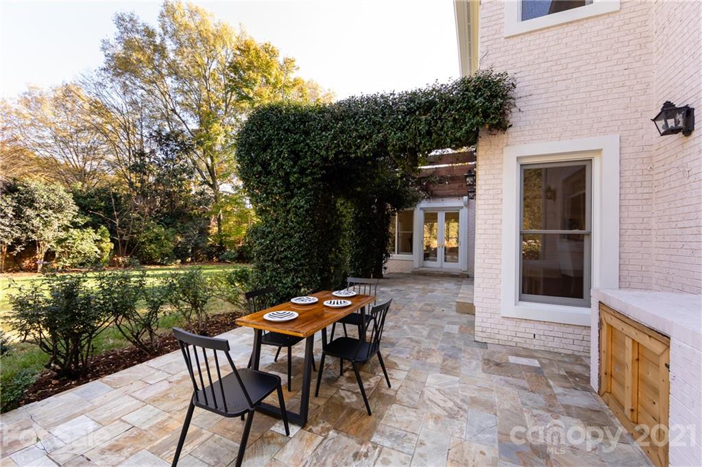 4407 Oglukian Road Charlotte, NC 28226 - Photo 47 of 48 a backyard of a house with wooden floor and outdoor seating