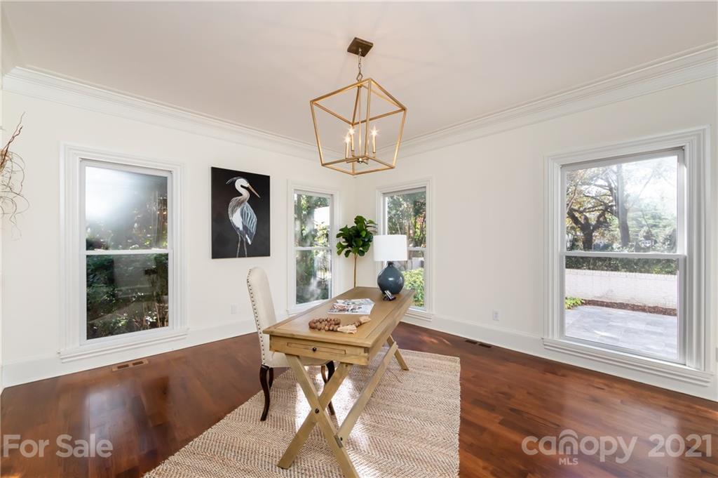 4407 Oglukian Road Charlotte, NC 28226 - Photo 6 of 48 a view of a dining room with furniture window and wooden floor