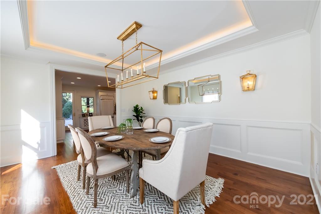 4407 Oglukian Road Charlotte, NC 28226 - Photo 7 of 48 a view of a dining room with furniture and wooden floor
