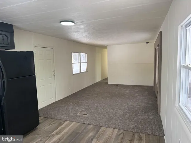 a view of empty room with windows