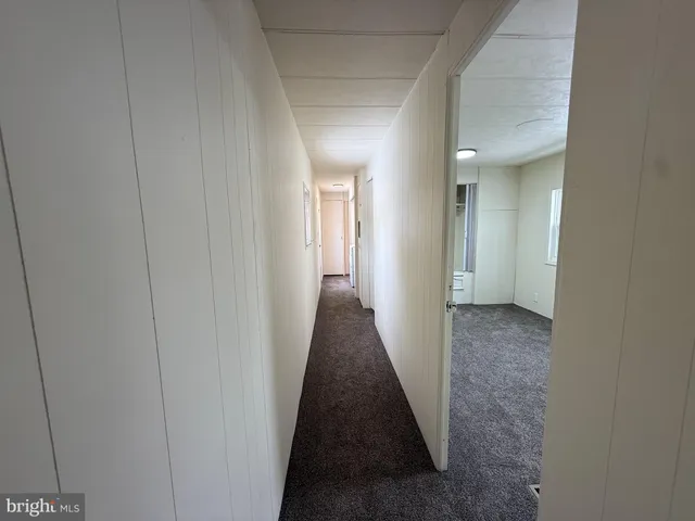 a view of a hallway with a furniture