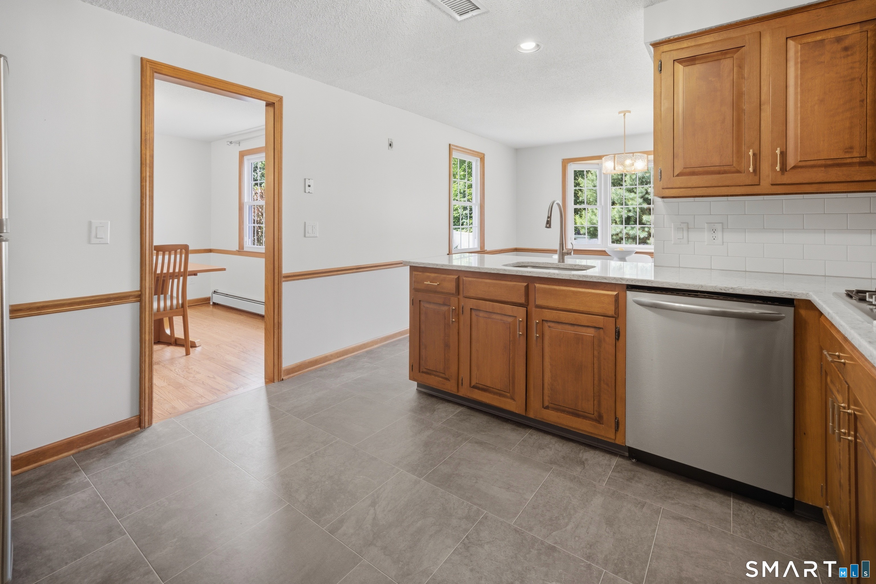 211 Valley View Road Manchester, CT 06040 - Photo 12 of 39 a view of a kitchen with a sink cabinets and a window