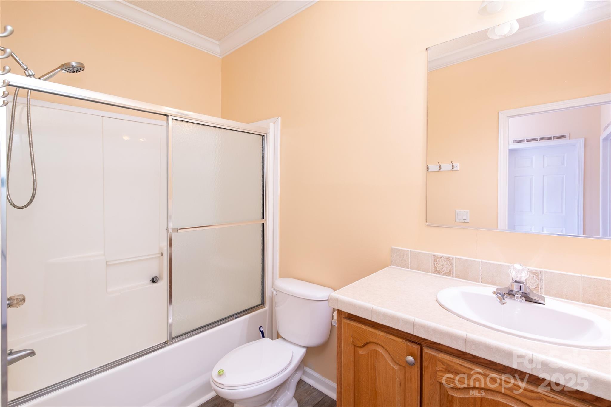 407 Monteith Gap Road Cullowhee, NC 28723 - Photo 20 of 23 a bathroom with a sink a toilet and shower