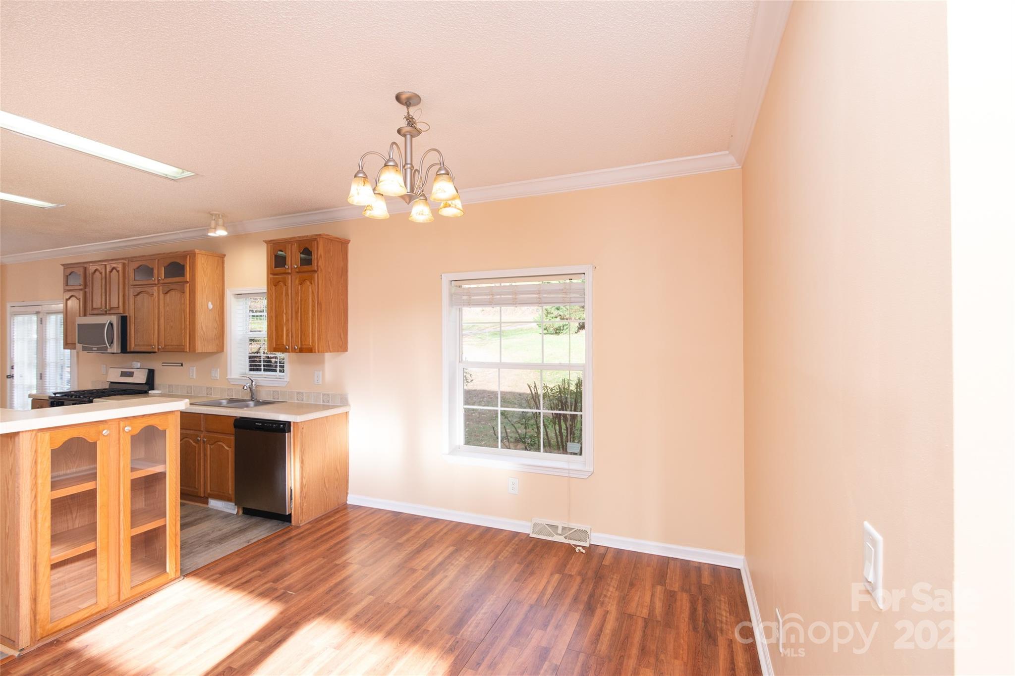 407 Monteith Gap Road Cullowhee, NC 28723 - Photo 7 of 23 a view of a kitchen with a sink and wooden floor