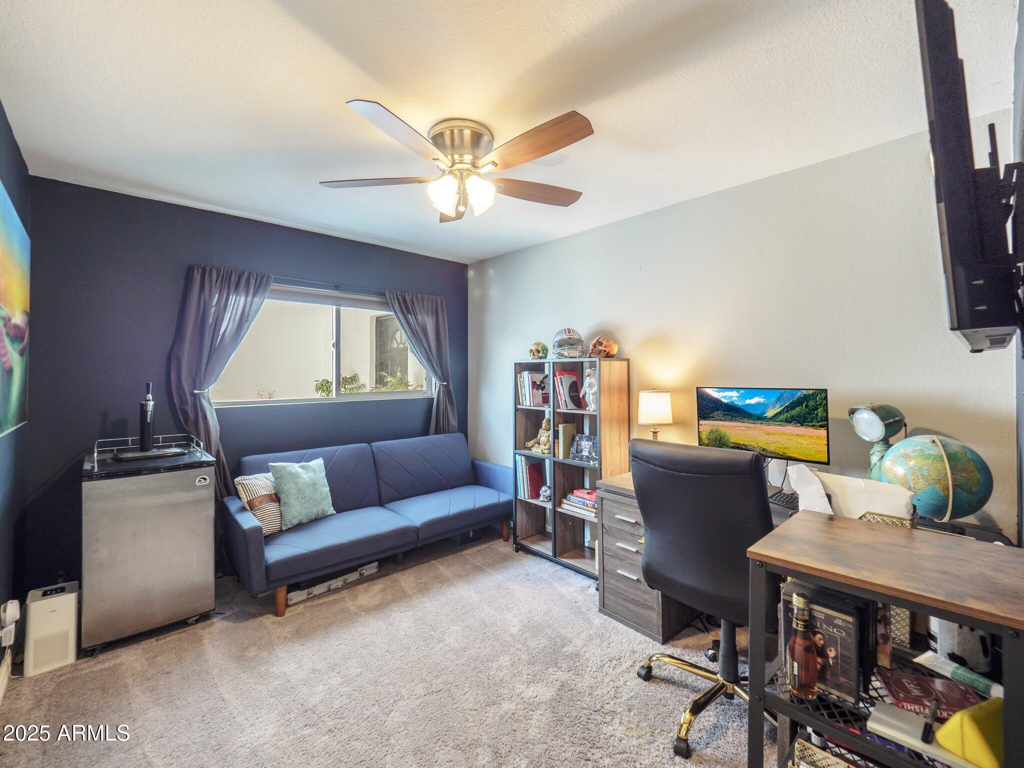 8728 East Monte Vista Road Scottsdale, AZ 85257 - Photo 16 of 28 a living room with furniture and a window