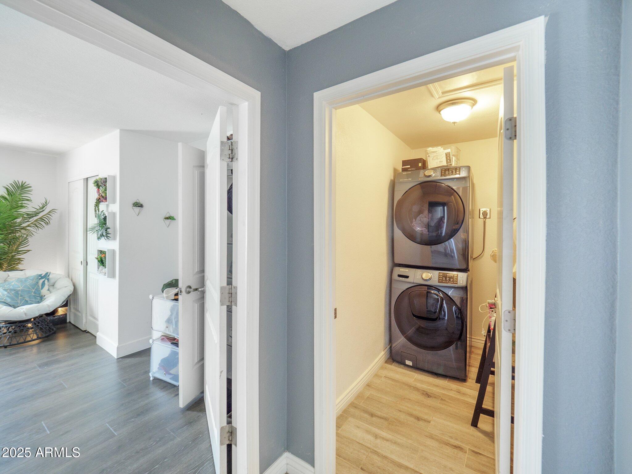 8728 East Monte Vista Road Scottsdale, AZ 85257 - Photo 19 of 28 a view of a hallway with washer and dryer