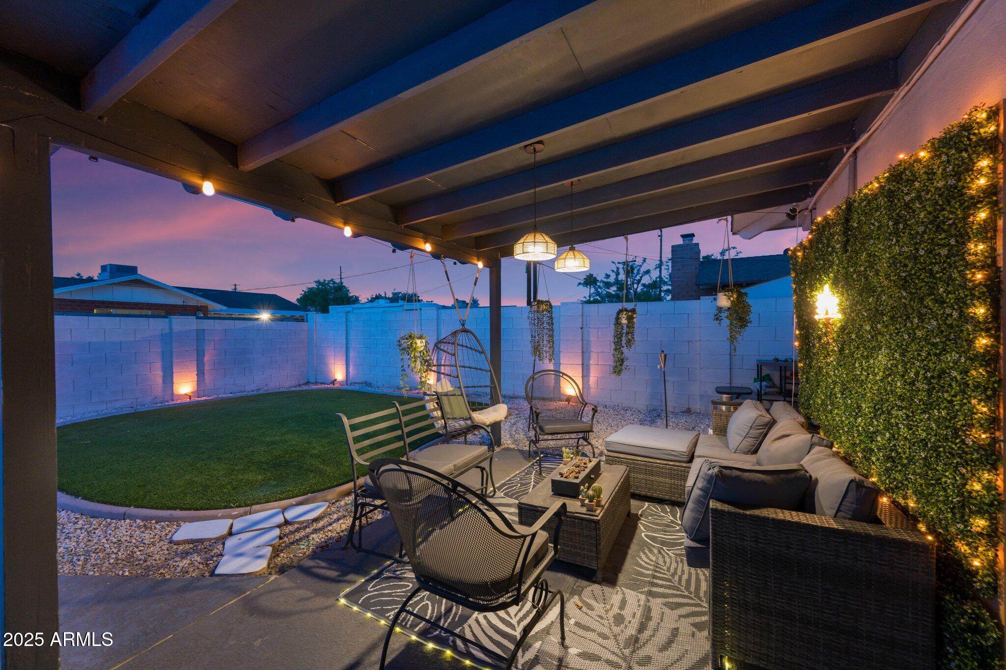 8728 East Monte Vista Road Scottsdale, AZ 85257 - Photo 20 of 28 a outdoor living space with furniture and a fireplace