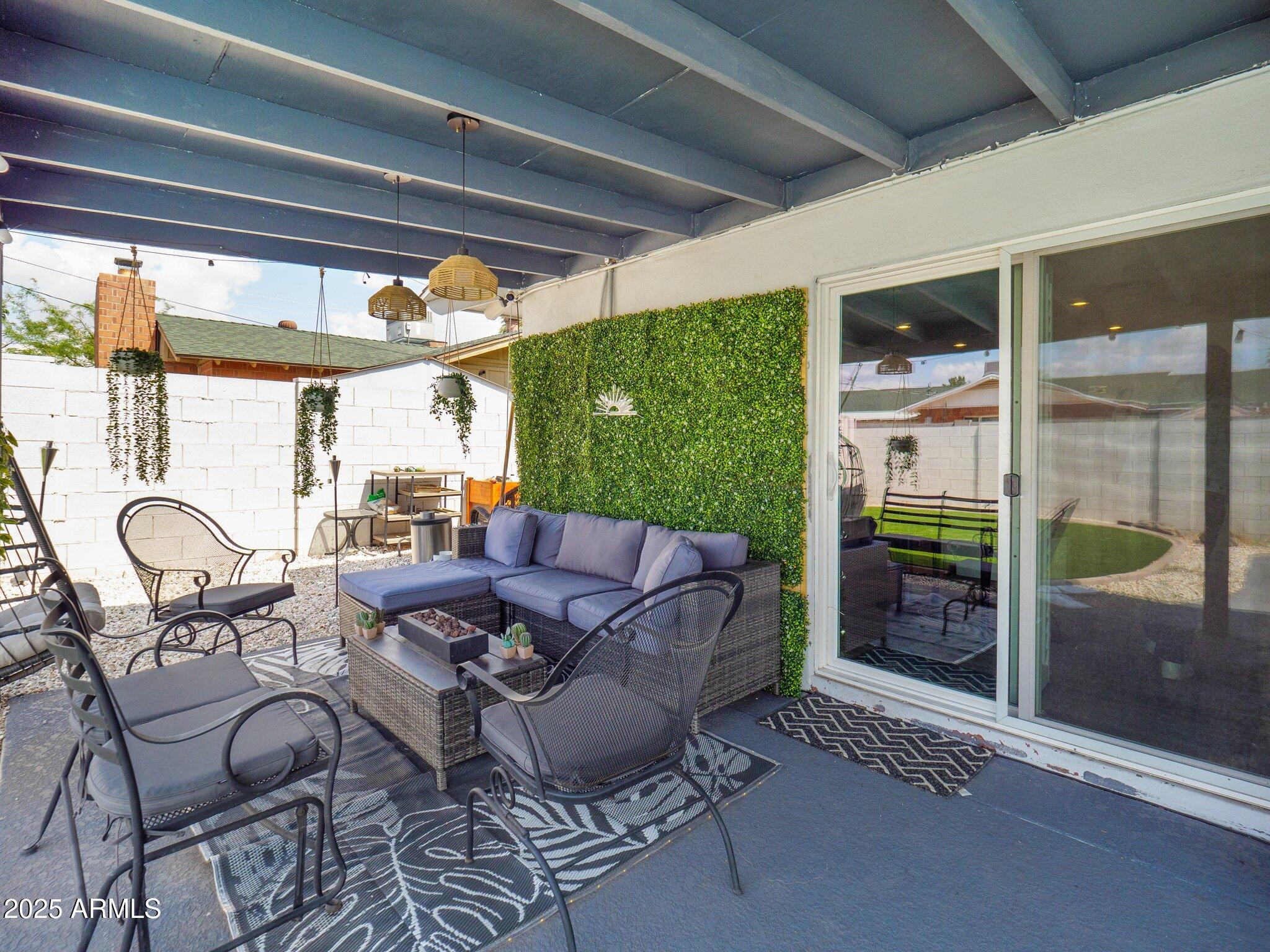 8728 East Monte Vista Road Scottsdale, AZ 85257 - Photo 25 of 28 a living room with furniture and a floor to ceiling window