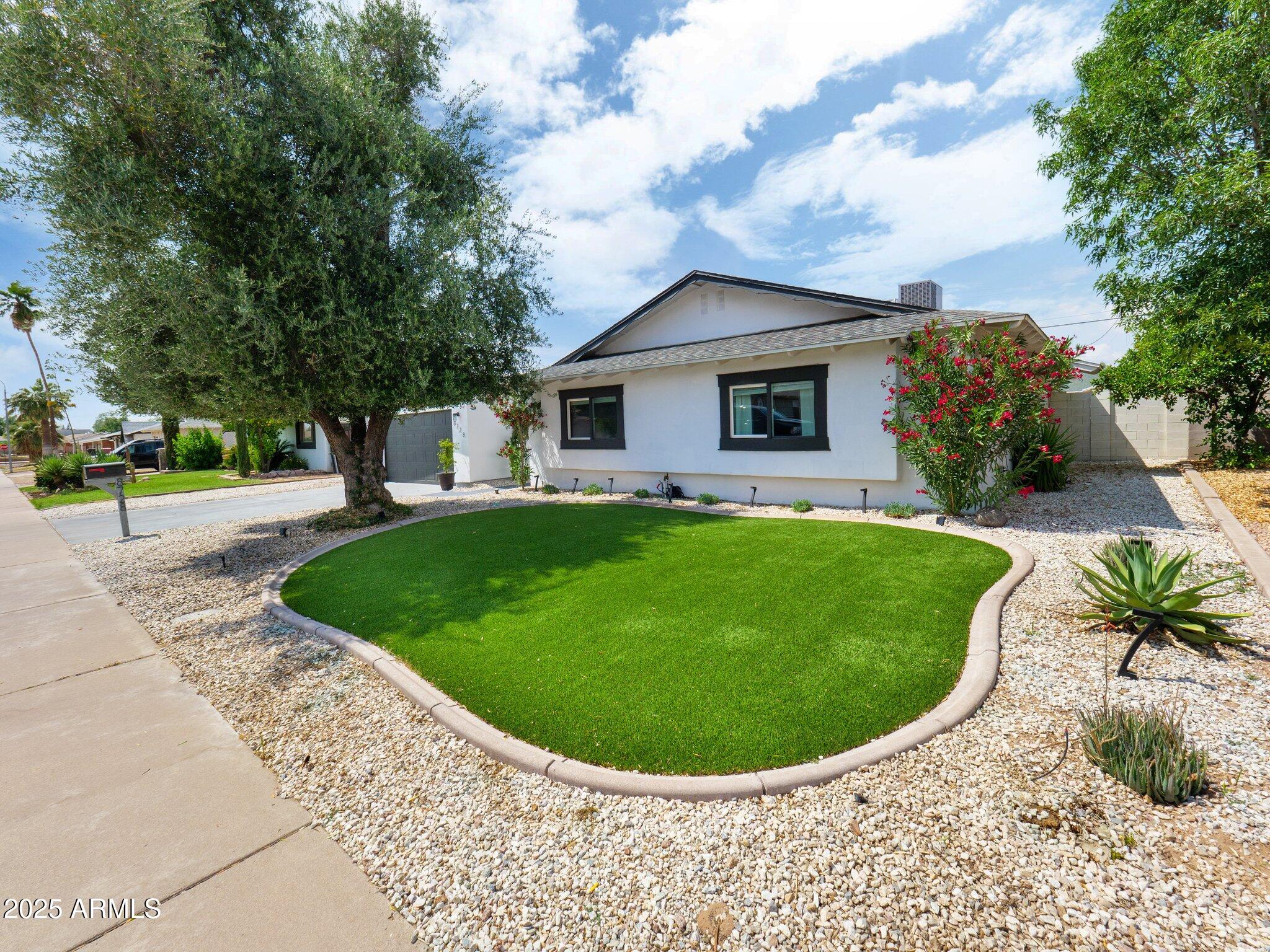 8728 East Monte Vista Road Scottsdale, AZ 85257 - Photo 27 of 28 a view of a house with a backyard porch and sitting area