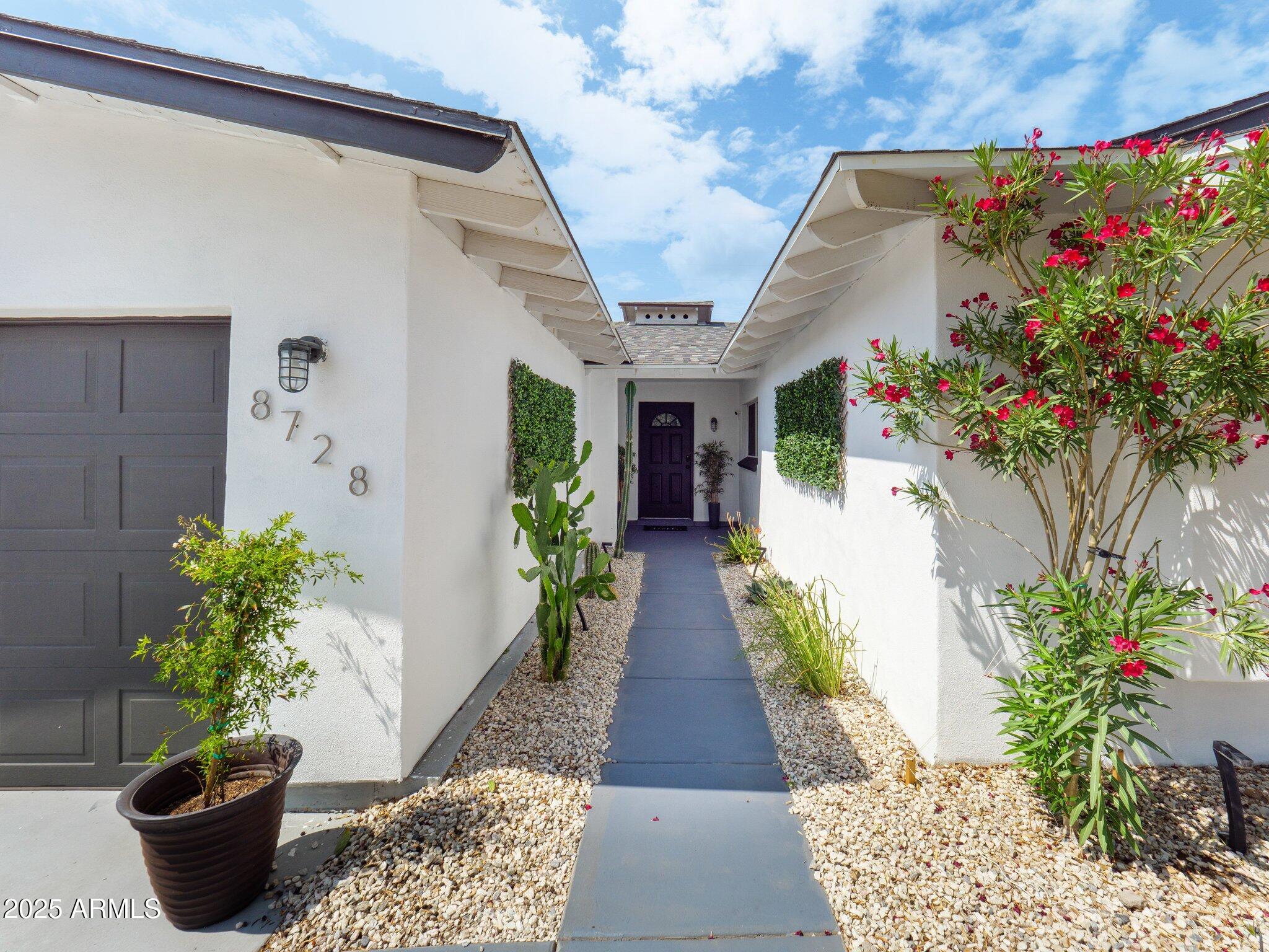 8728 East Monte Vista Road Scottsdale, AZ 85257 - Photo 28 of 28 a front view of a house with plants
