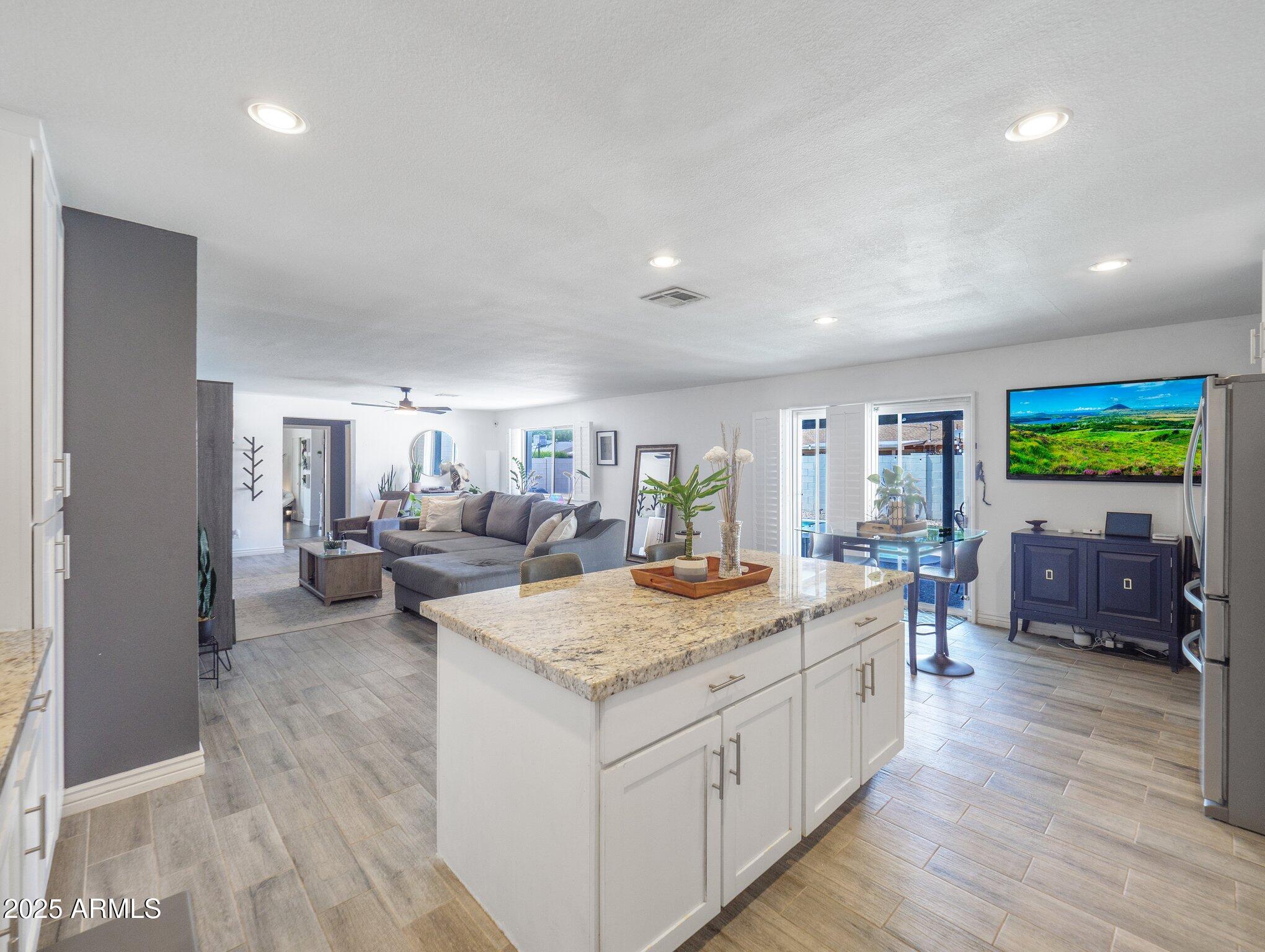8728 East Monte Vista Road Scottsdale, AZ 85257 - Photo 9 of 28 a view of living room filled with furniture and flat screen tv