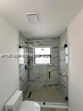 19823 Southwest 119th Court Miami, FL 33177 - Photo 23 of 33 a bathroom with a shower and a toilet