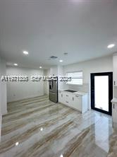 19823 Southwest 119th Court Miami, FL 33177 - Photo 5 of 33 a view of open kitchen with a sink