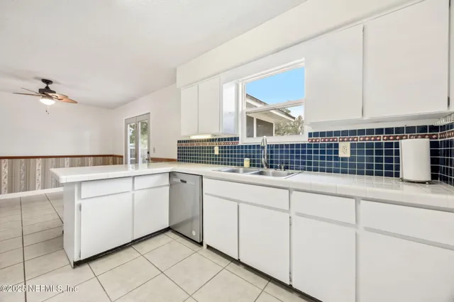 a kitchen with a sink and cabinets
