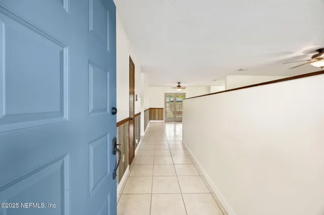 a hallway with a white stove top oven