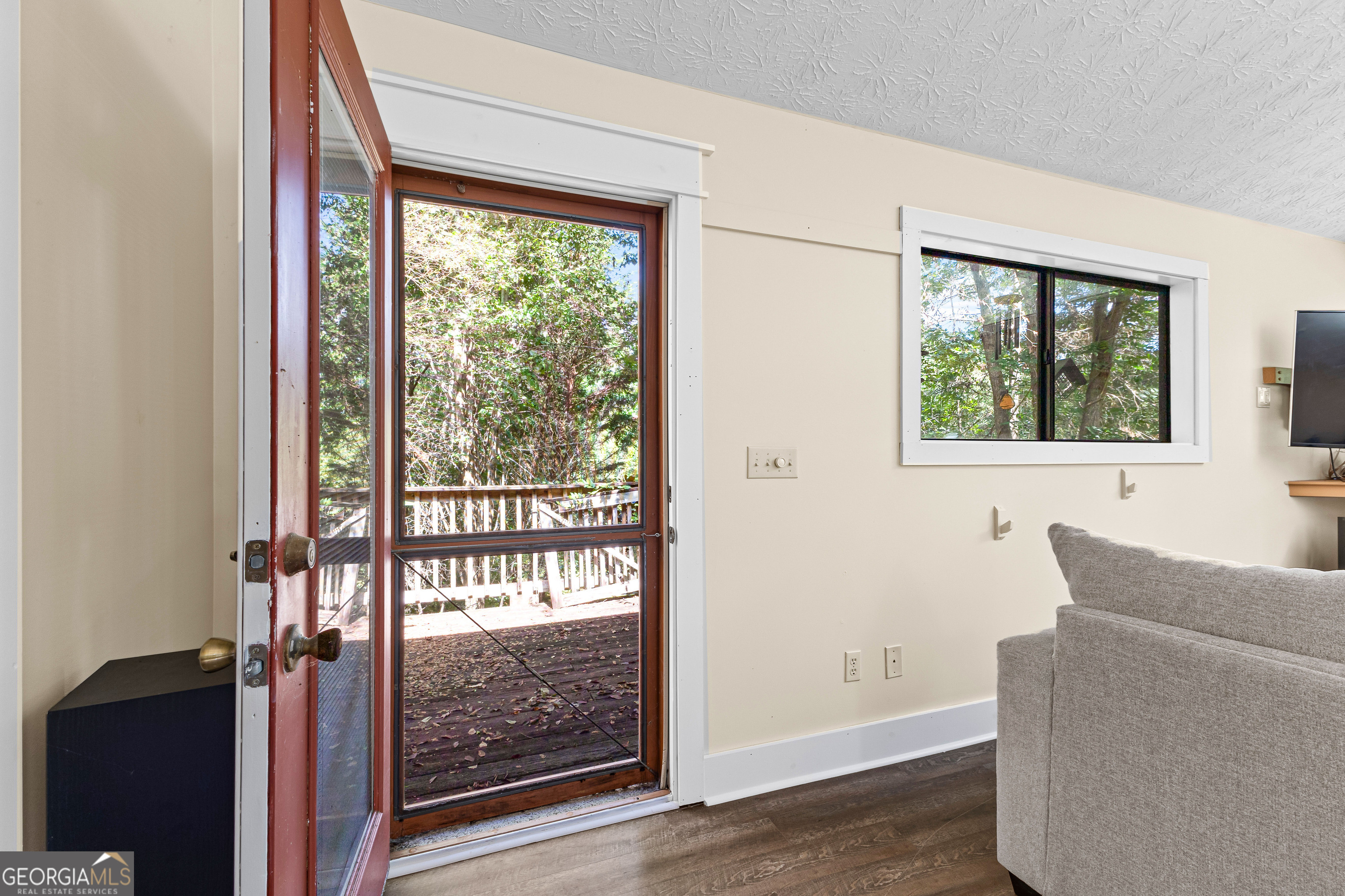 329 Chickadee Court Monticello, GA 31064 - Photo 11 of 59 a living room with furniture and a window