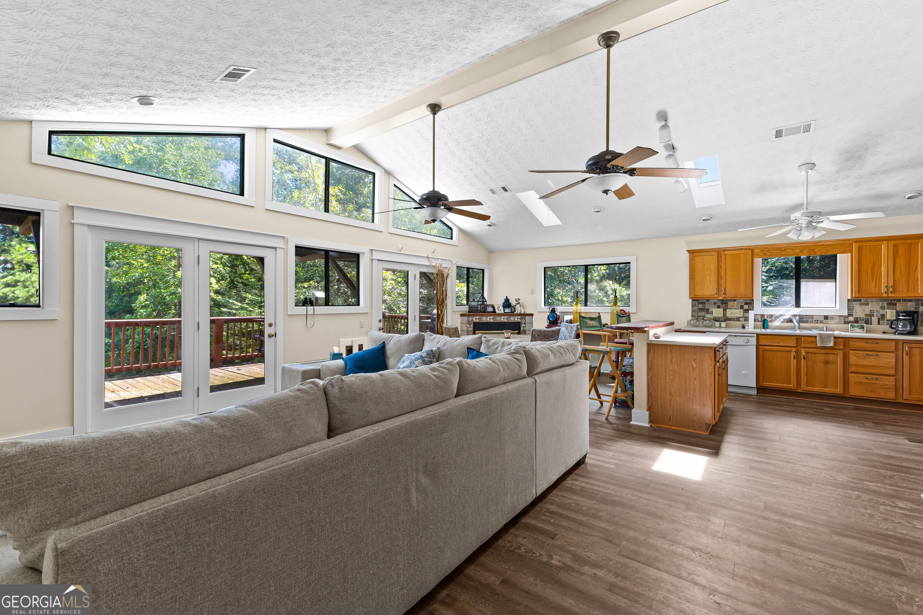329 Chickadee Court Monticello, GA 31064 - Photo 14 of 59 a living room with furniture kitchen and a chandelier