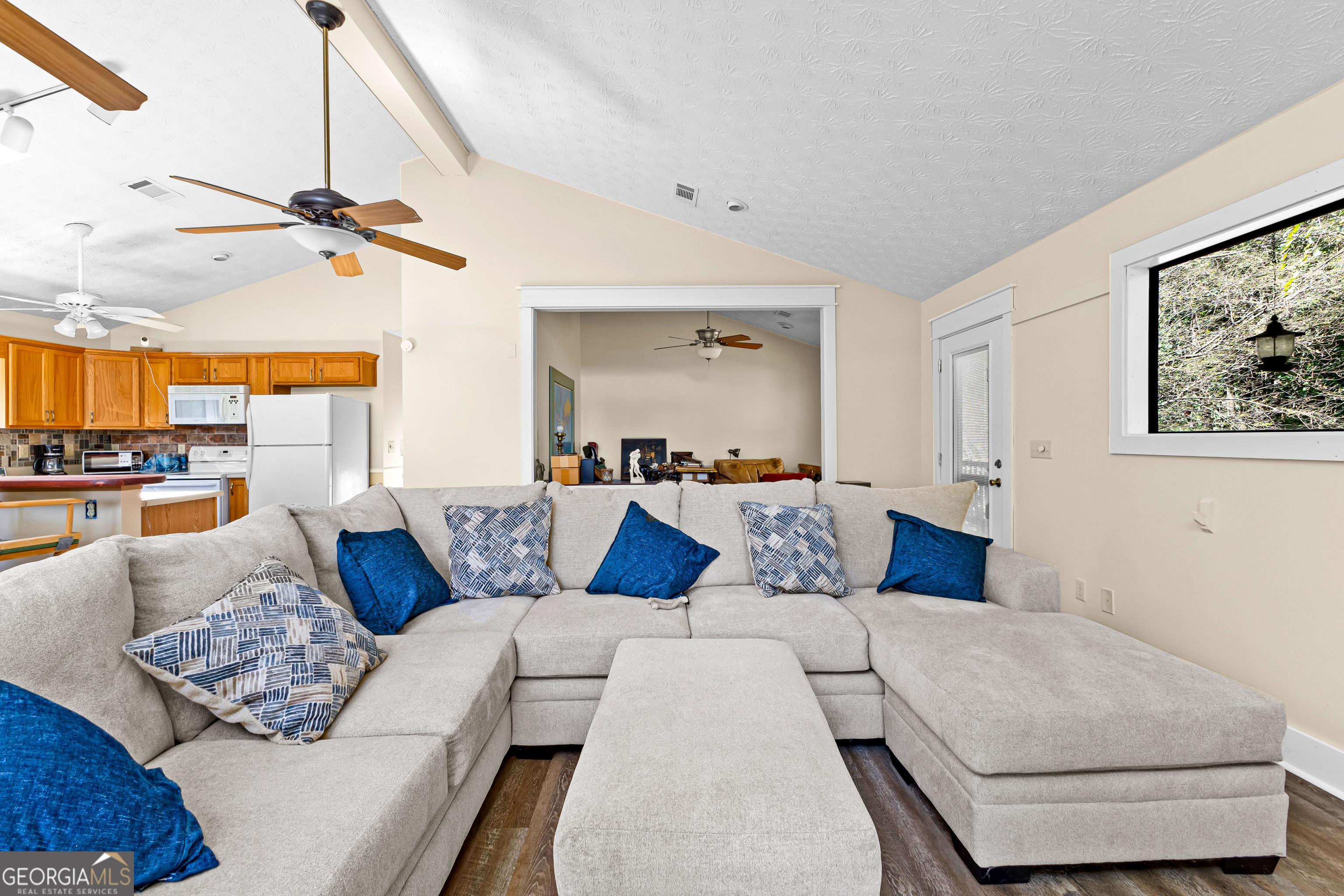 329 Chickadee Court Monticello, GA 31064 - Photo 24 of 59 a living room with furniture and a ceiling fan