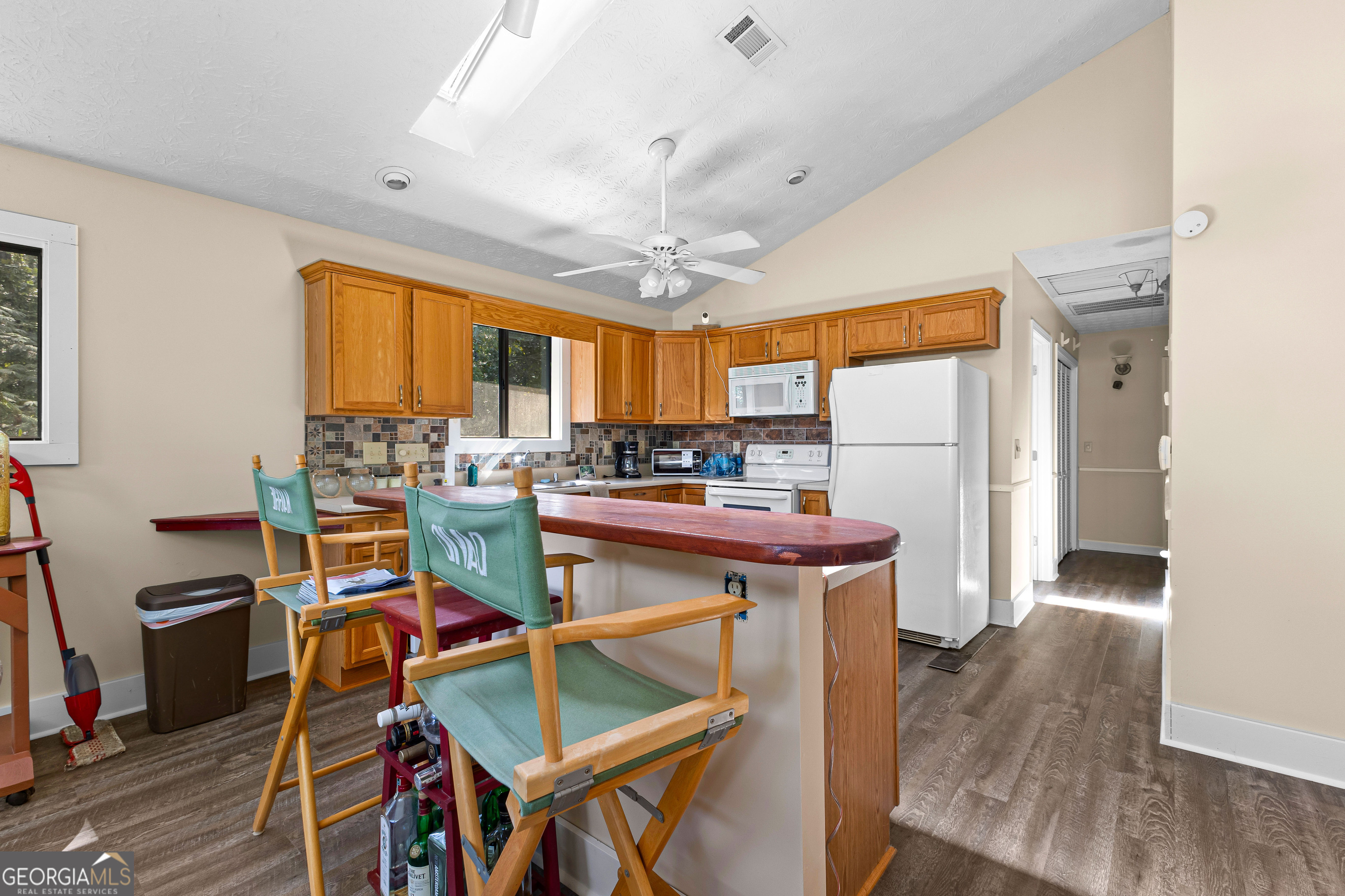 329 Chickadee Court Monticello, GA 31064 - Photo 26 of 59 a open kitchen with stainless steel appliances granite countertop a stove and a refrigerator
