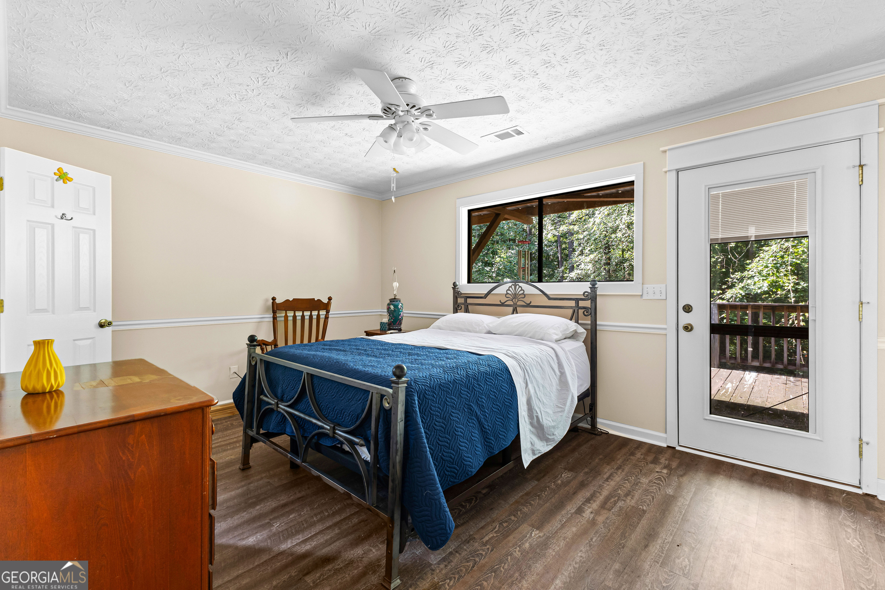 329 Chickadee Court Monticello, GA 31064 - Photo 28 of 59 a bedroom with a bed table closet and a window