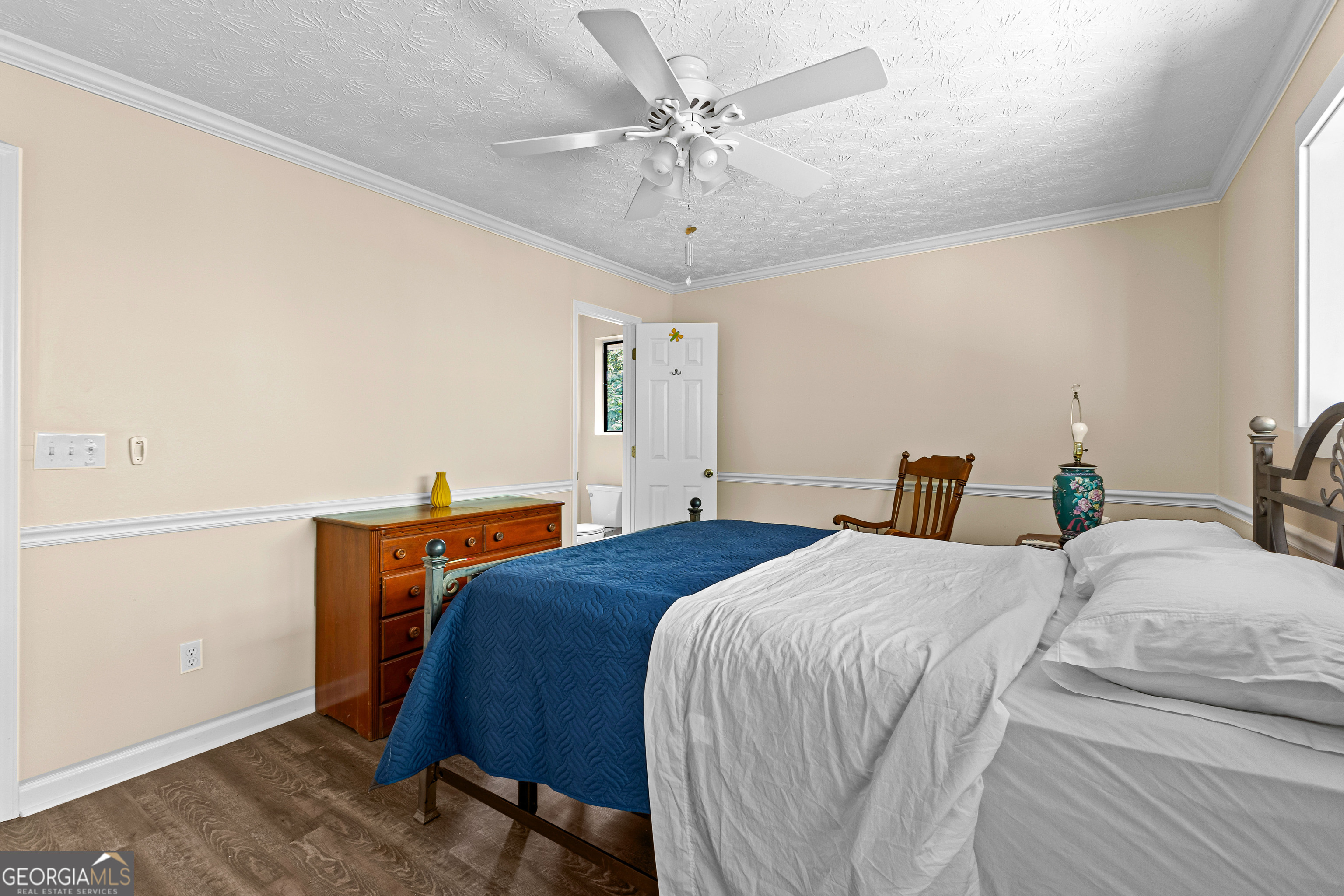 329 Chickadee Court Monticello, GA 31064 - Photo 29 of 59 a bedroom with a bed and a chandelier