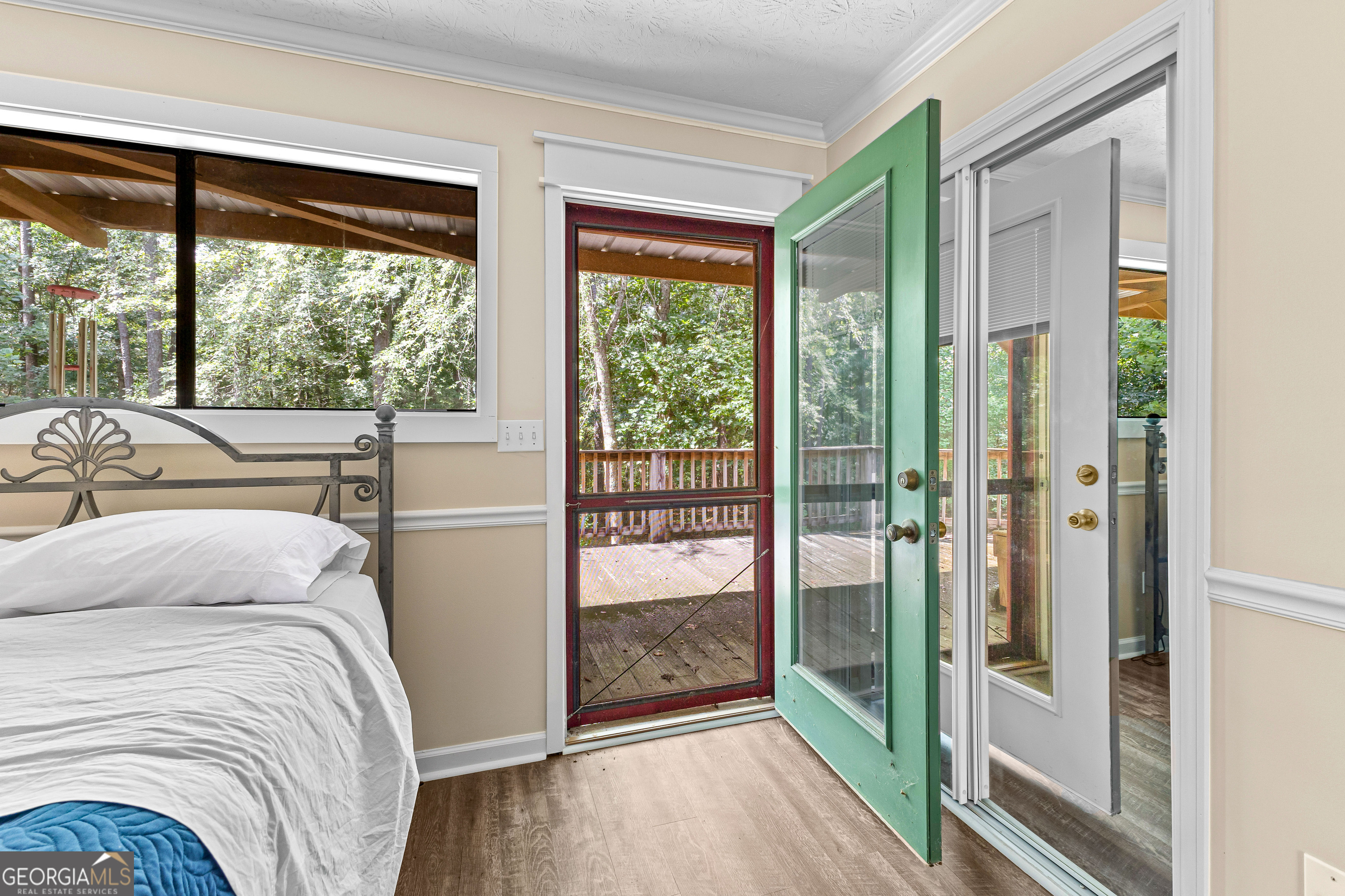 329 Chickadee Court Monticello, GA 31064 - Photo 32 of 59 a bedroom with a bed and glass door