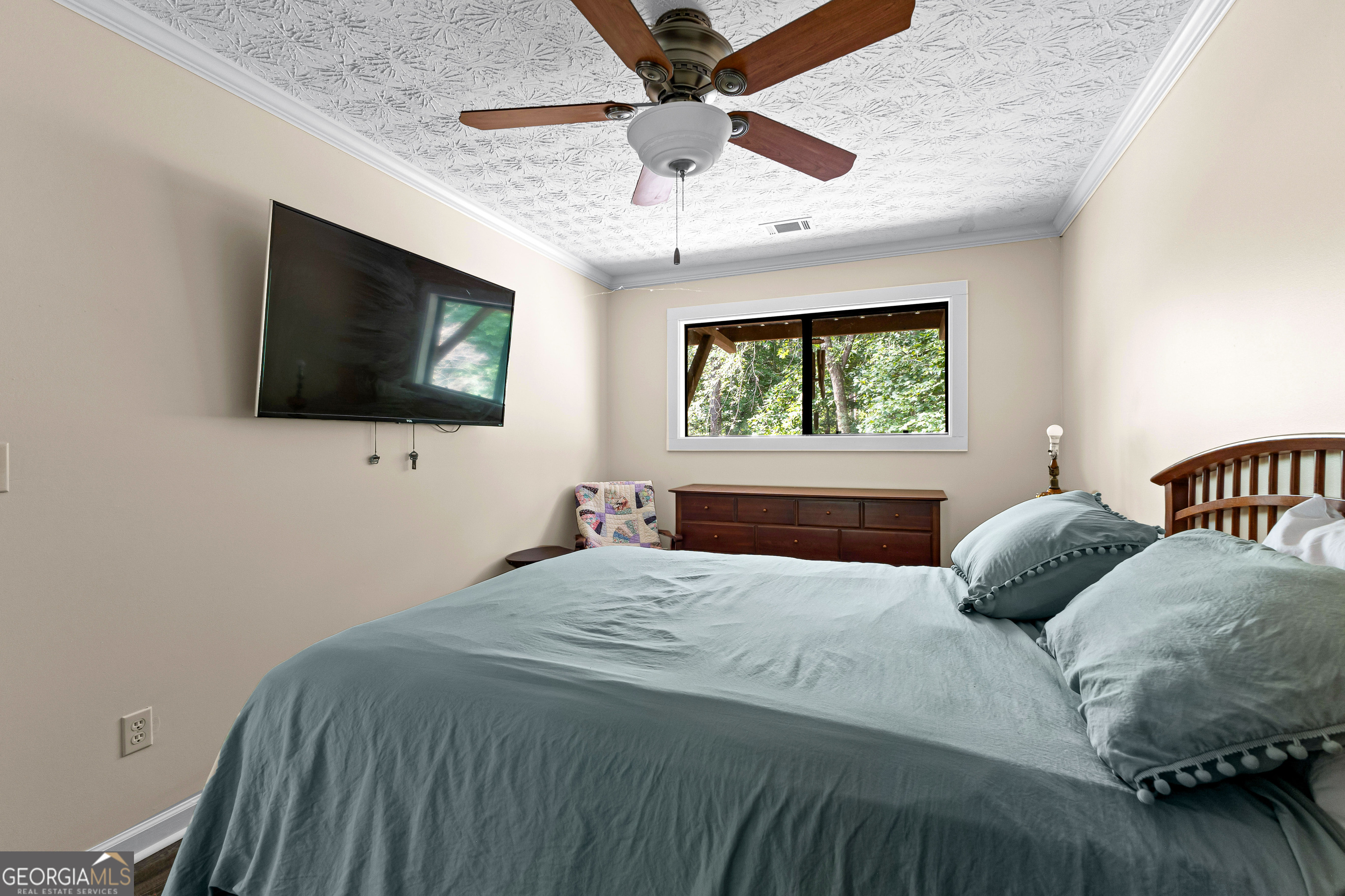 329 Chickadee Court Monticello, GA 31064 - Photo 36 of 59 a bedroom with a bed and a flat screen tv