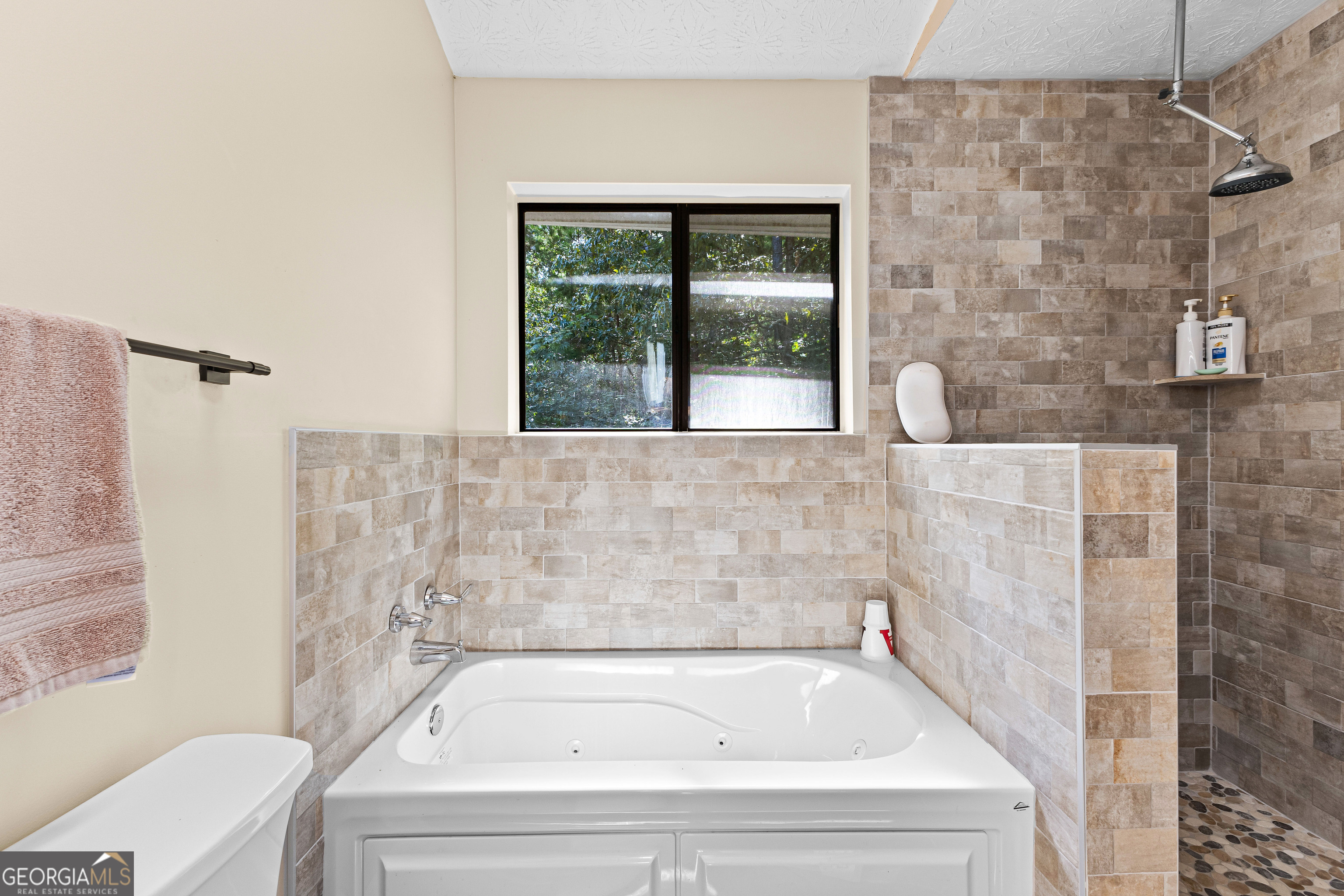 329 Chickadee Court Monticello, GA 31064 - Photo 41 of 59 a bath tub sitting next to a window
