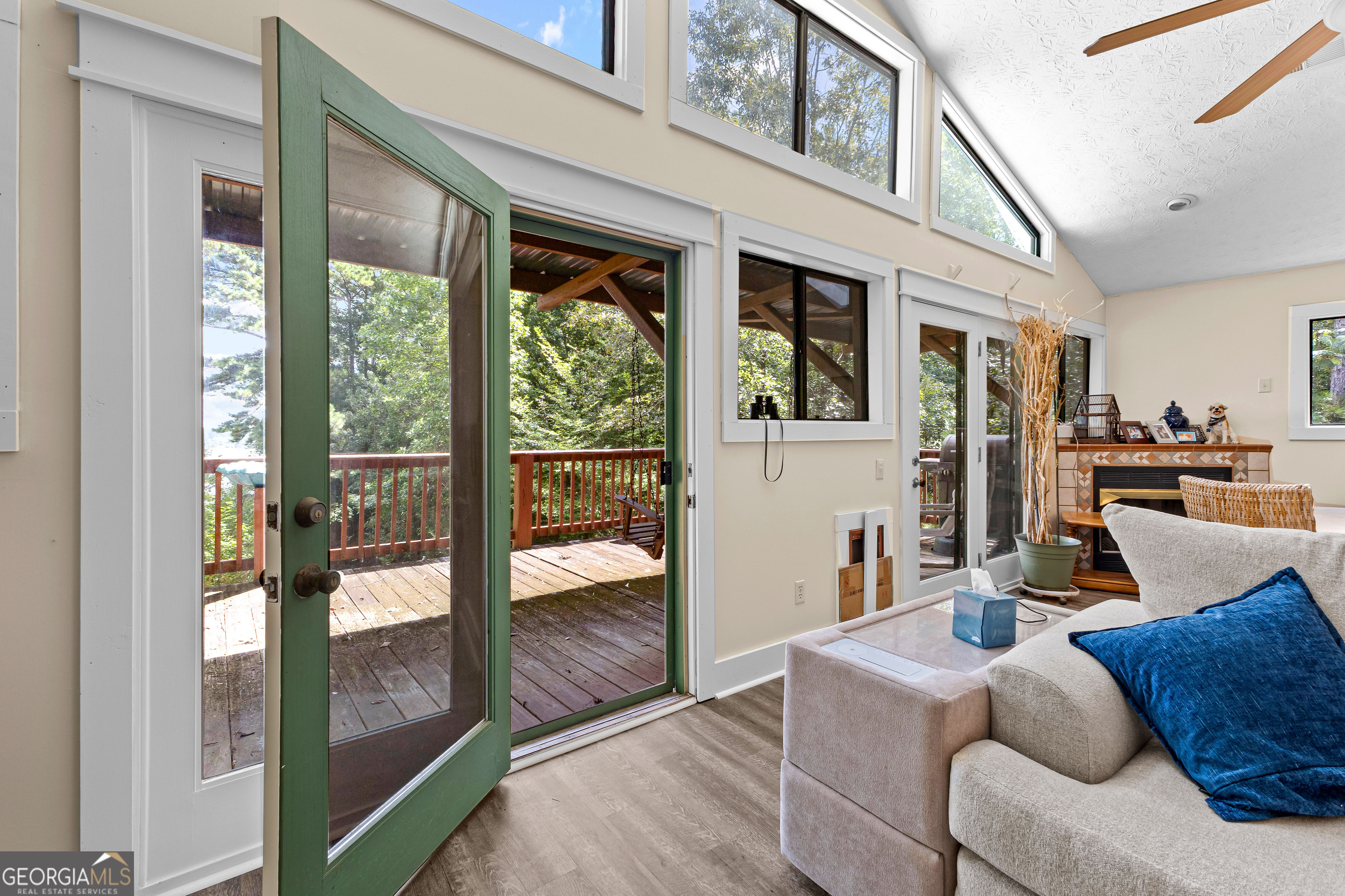 329 Chickadee Court Monticello, GA 31064 - Photo 43 of 59 a living room with furniture and a floor to ceiling window
