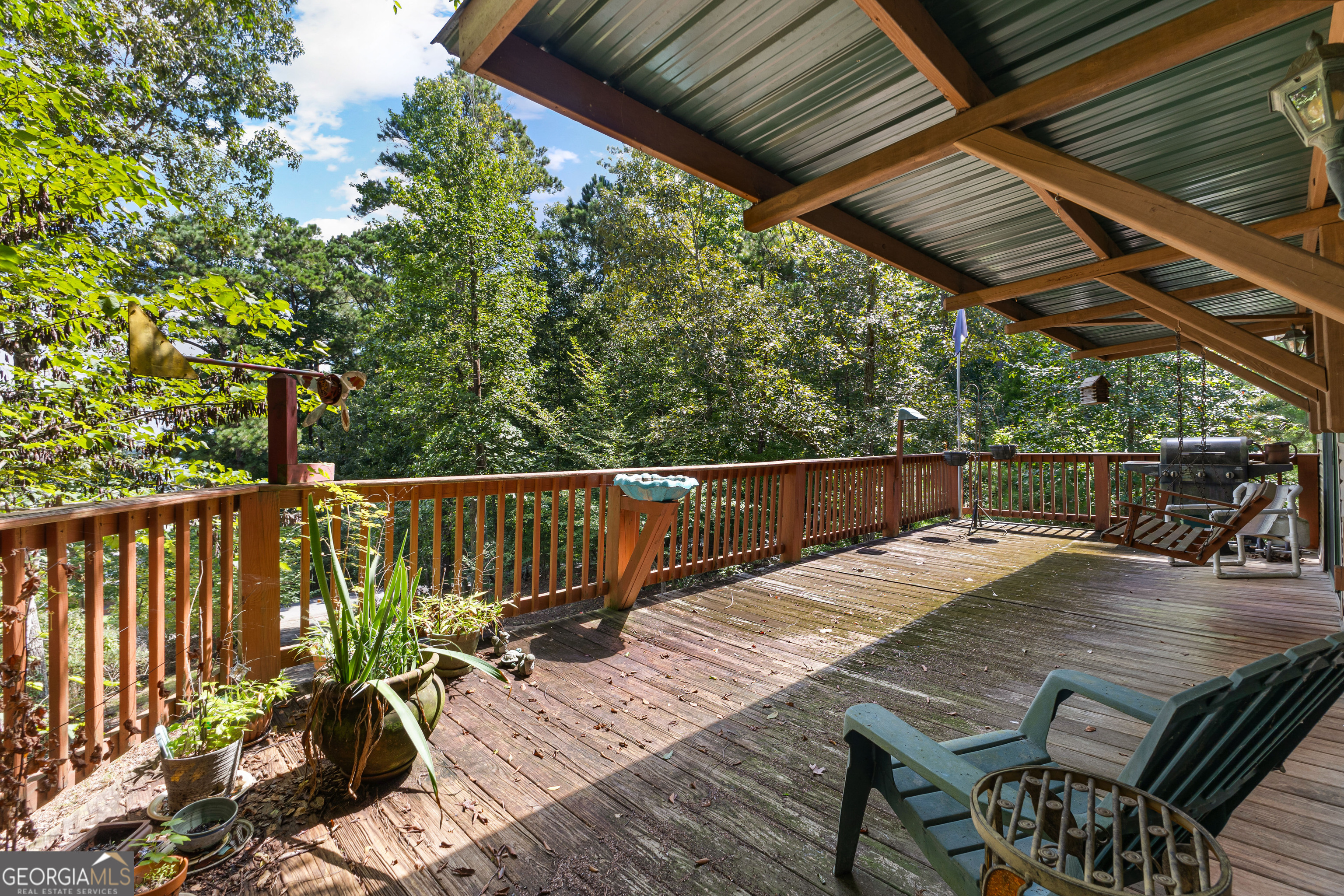 329 Chickadee Court Monticello, GA 31064 - Photo 44 of 59 a view of balcony with wooden floor and outdoor seating