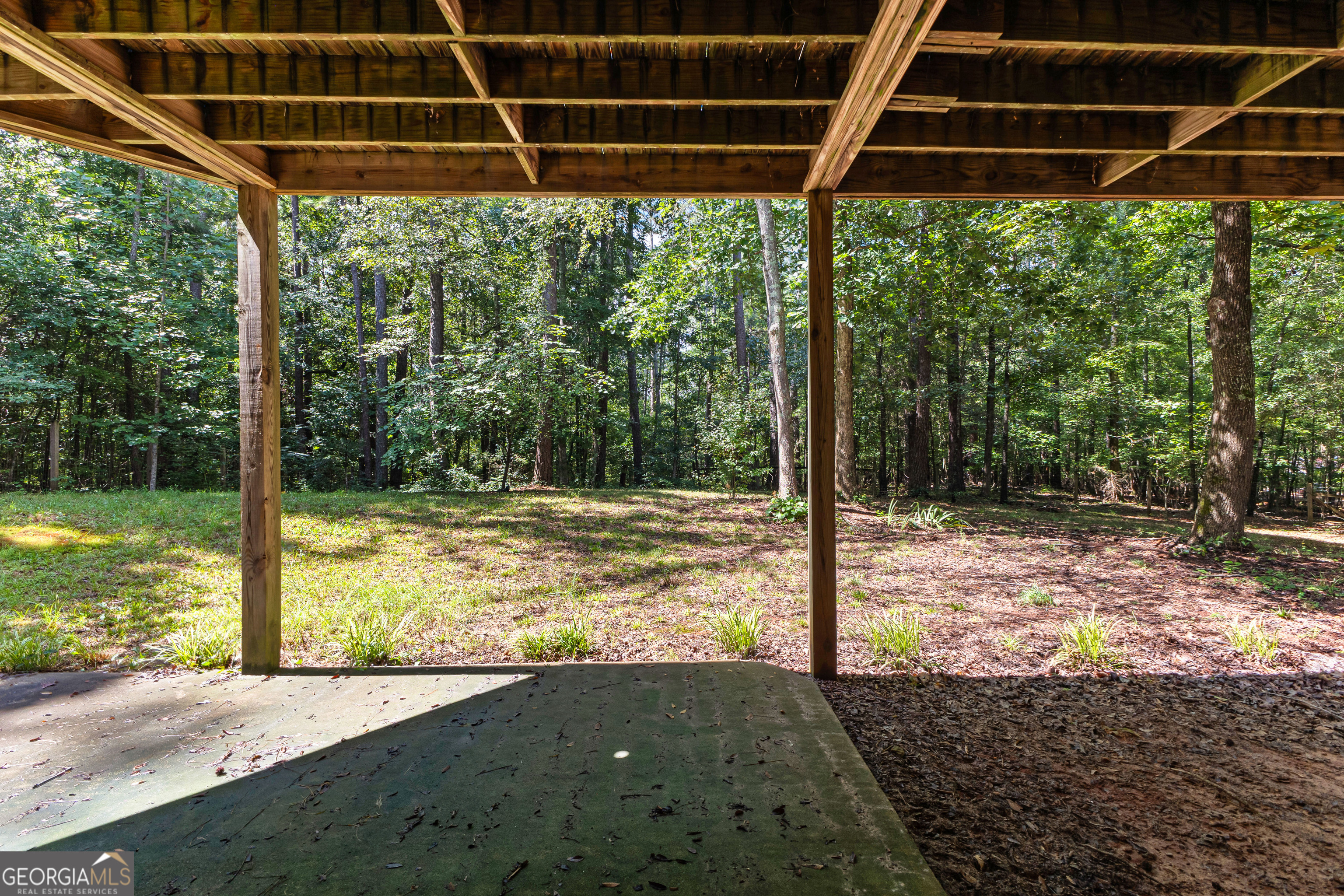 329 Chickadee Court Monticello, GA 31064 - Photo 50 of 59 a view of a backyard with floor to ceiling window and tree