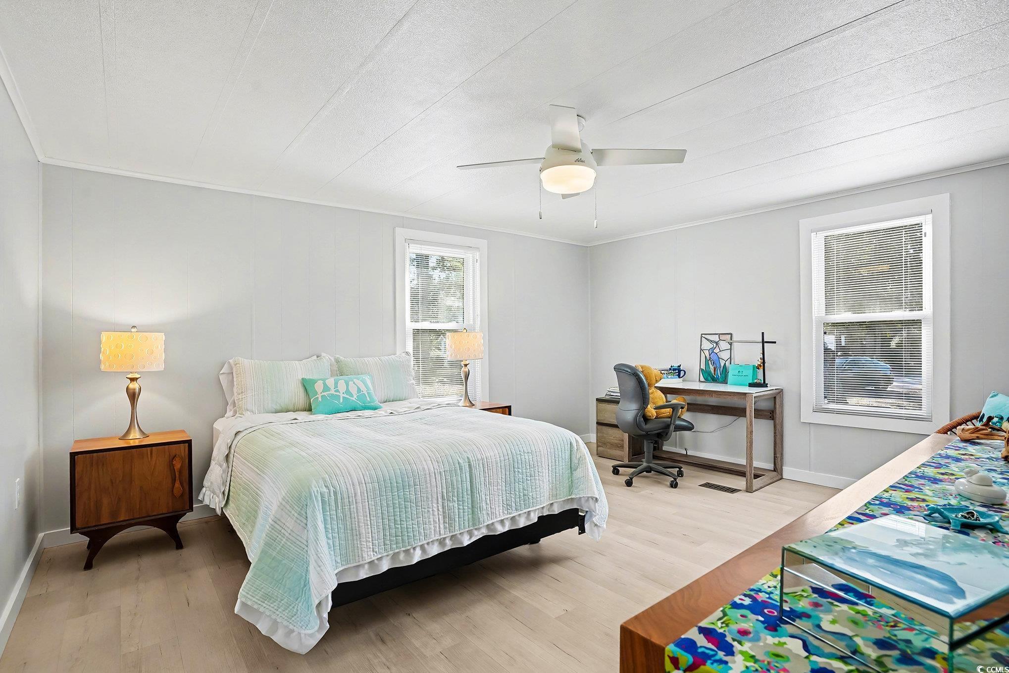 3268 Pecan Trail Murrells Inlet, SC 29576 - Photo 15 of 38 Bedroom with light wood finished floors, a ceiling fan, a desk, and crown molding