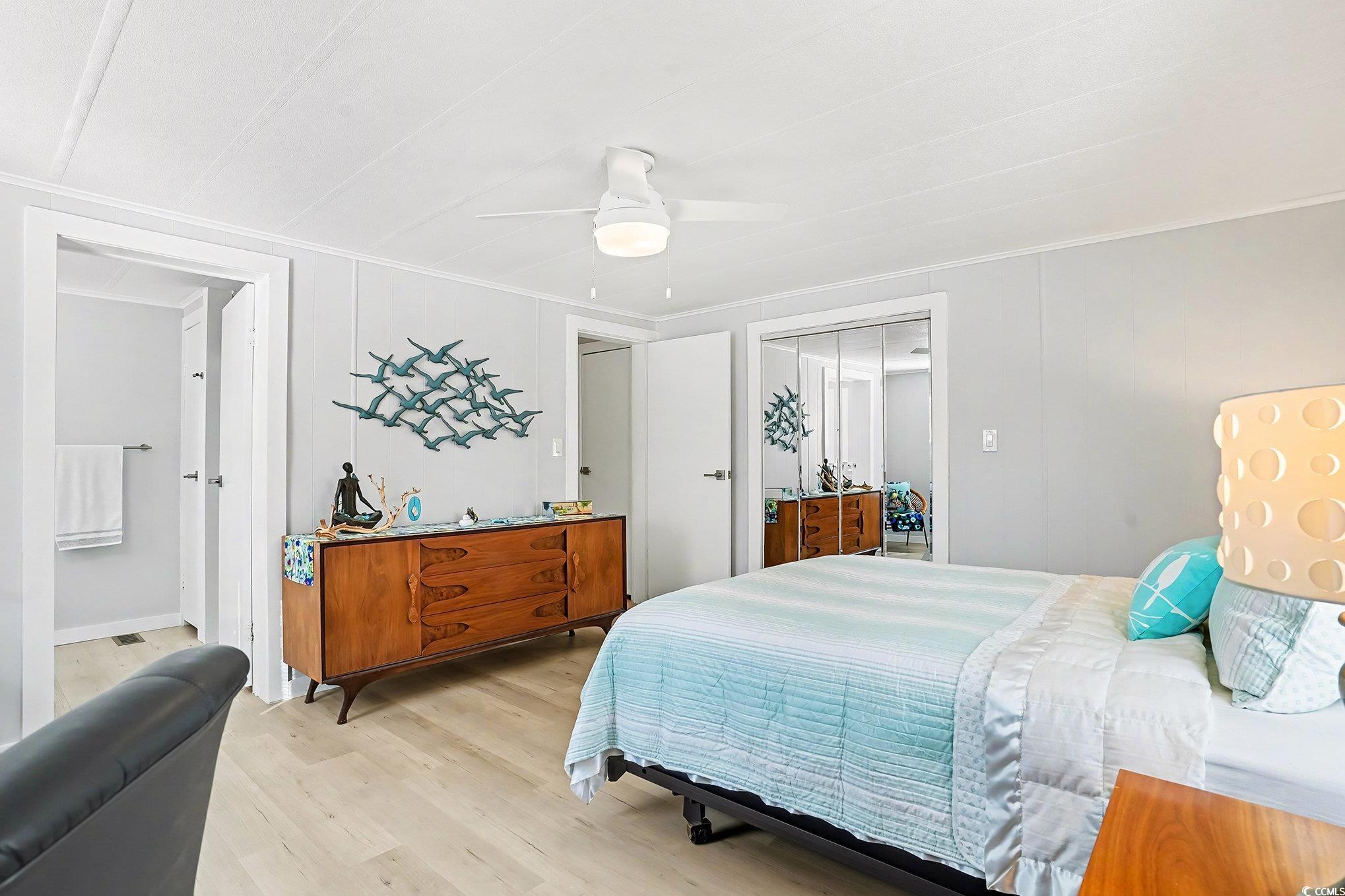 3268 Pecan Trail Murrells Inlet, SC 29576 - Photo 16 of 38 Bedroom with light wood-type flooring, a closet, and ceiling fan