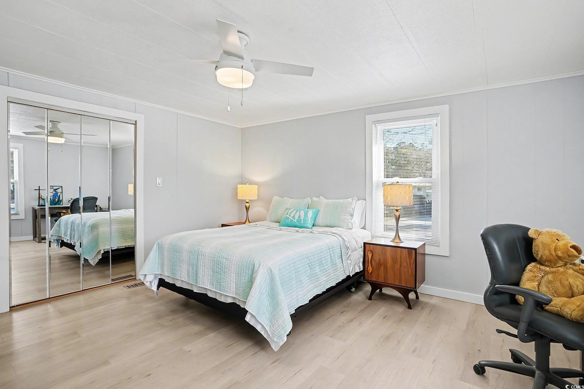 3268 Pecan Trail Murrells Inlet, SC 29576 - Photo 17 of 38 Bedroom featuring light wood-style floors, a closet, and ceiling fan