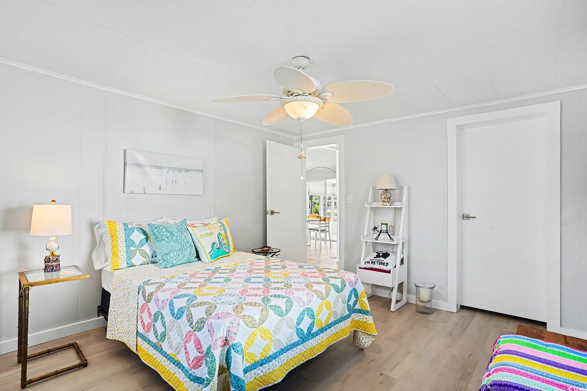 3268 Pecan Trail Murrells Inlet, SC 29576 - Photo 20 of 38 Bedroom with wood finished floors, ceiling fan, and ornamental molding