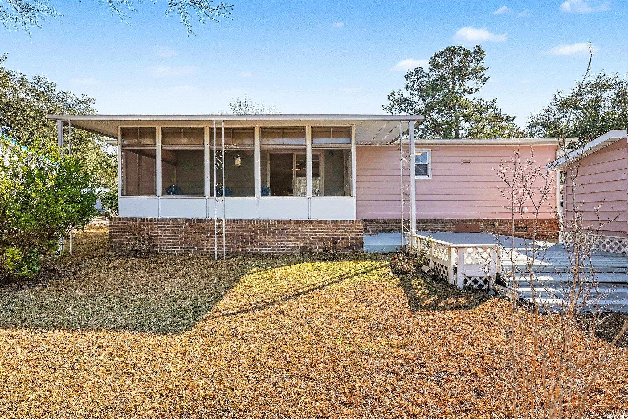 3268 Pecan Trail Murrells Inlet, SC 29576 - Photo 26 of 38 Deck with a sunroom