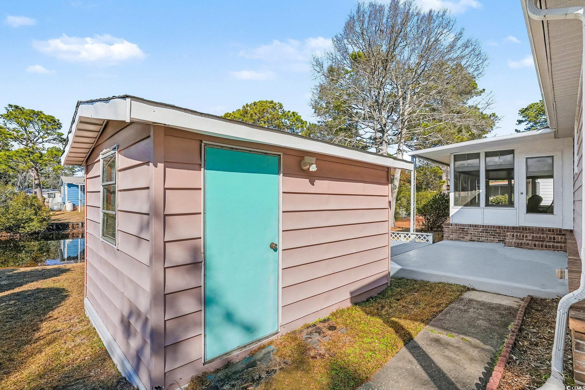 3268 Pecan Trail Murrells Inlet, SC 29576 - Photo 29 of 38 View of front of property with a sunroom and a wooden deck