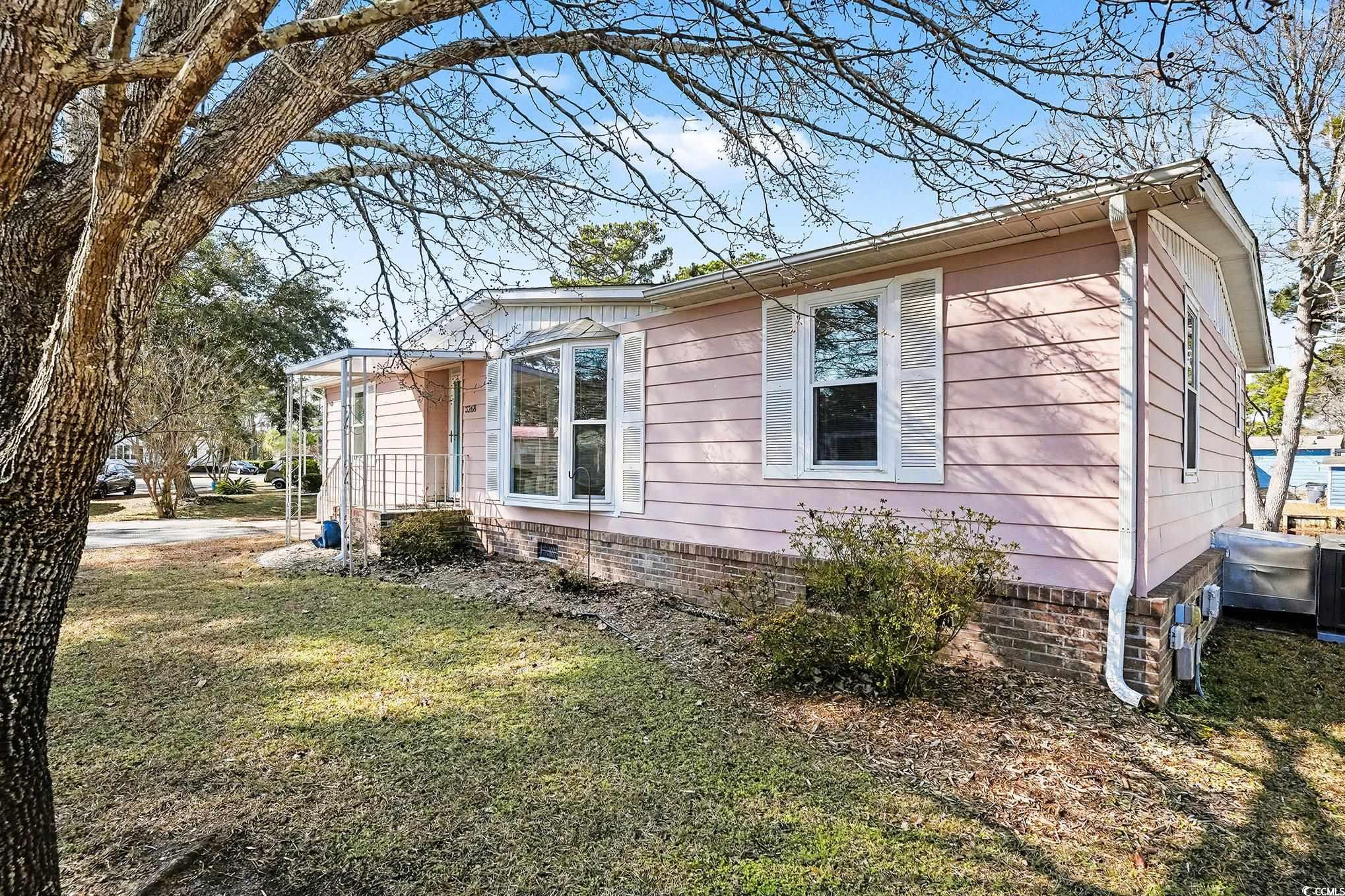 3268 Pecan Trail Murrells Inlet, SC 29576 - Photo 4 of 38 View of home's exterior featuring a yard and crawl space