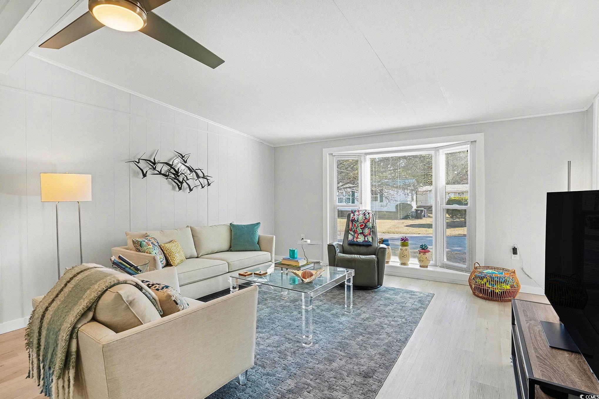 3268 Pecan Trail Murrells Inlet, SC 29576 - Photo 7 of 38 Living area featuring light wood-style flooring, lofted ceiling, and a ceiling fan